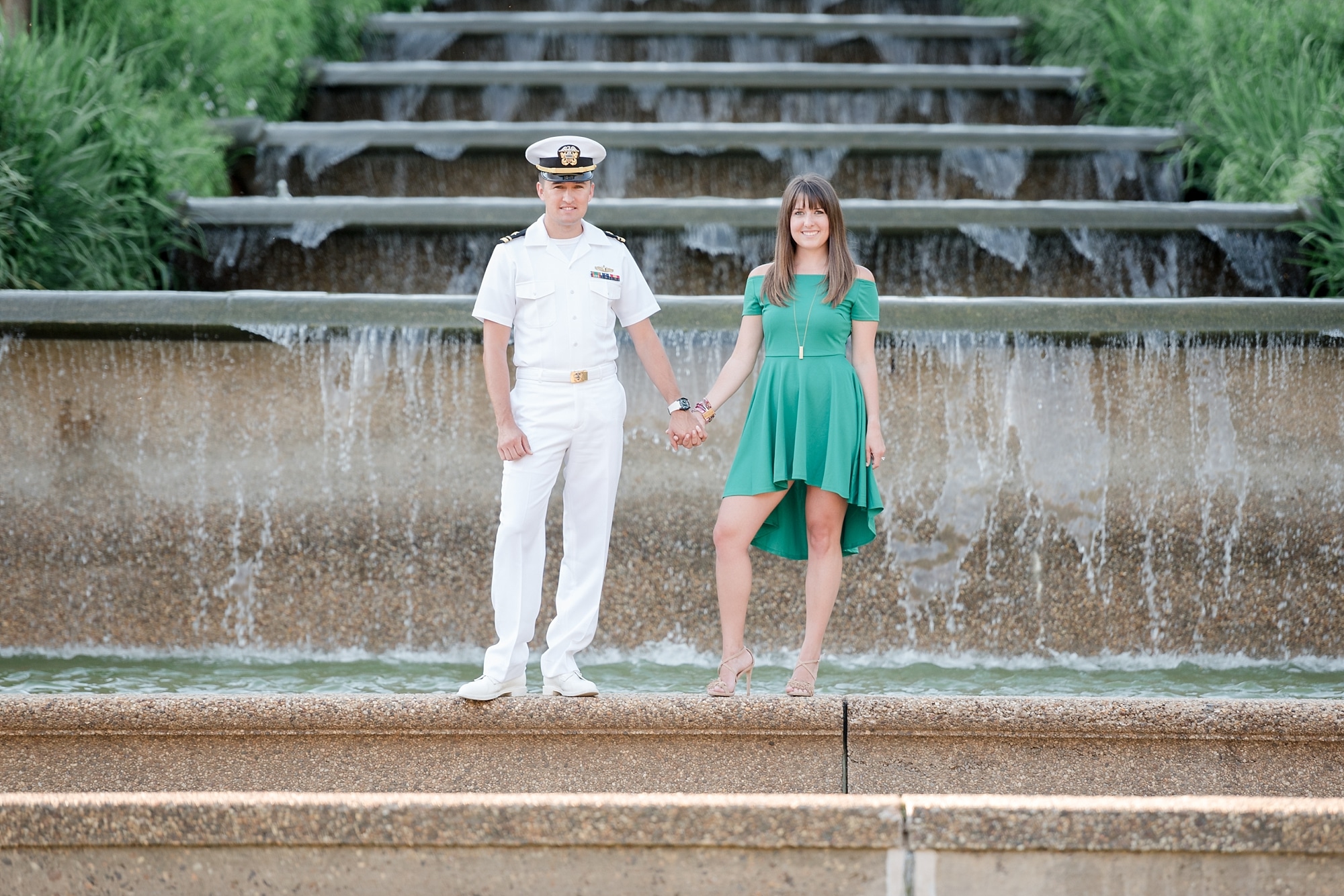 Engaged couple at base of fountain at Meridian Hill Park