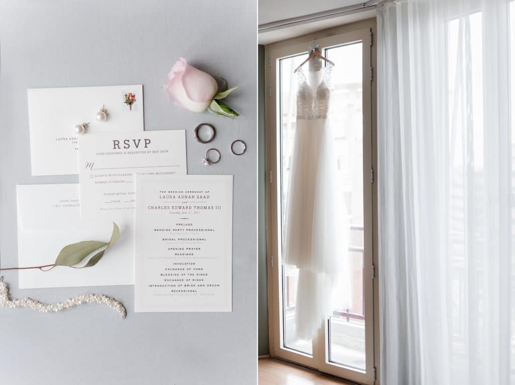 Invitations and bridal gown hanging in window of bridal suite