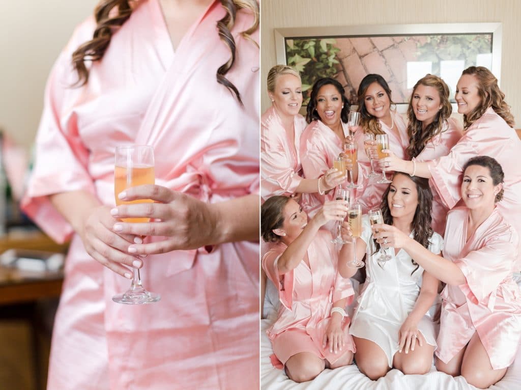 Bridesmaids in robes for cheers photo while getting ready