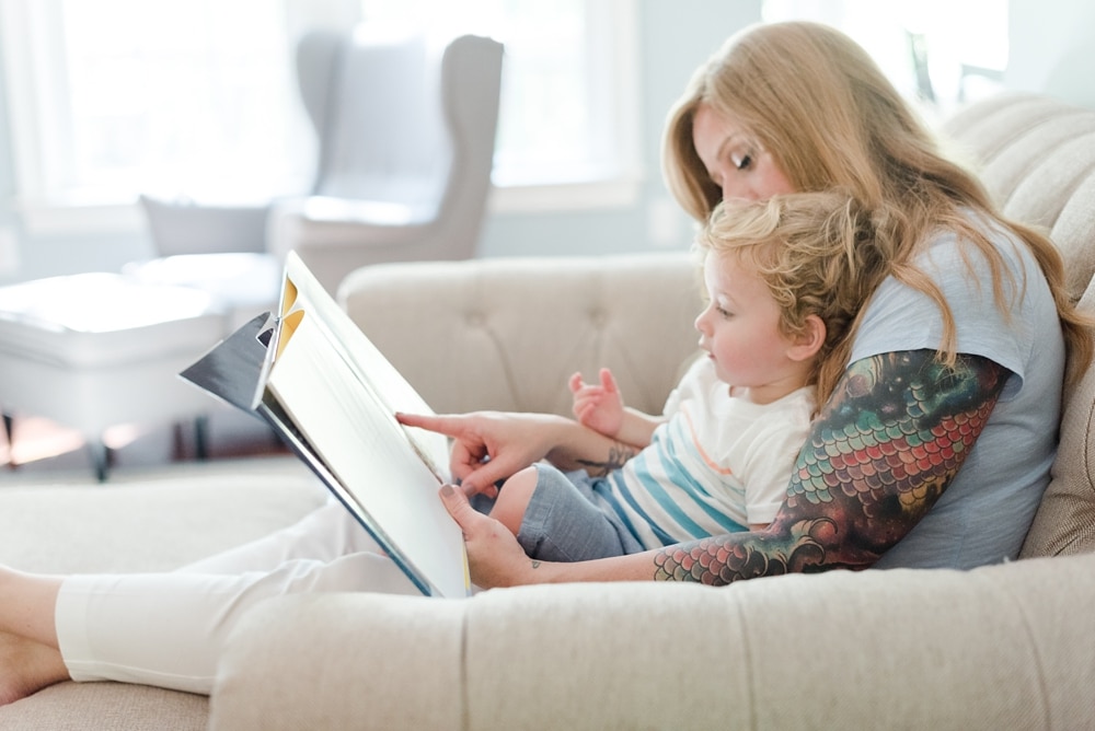 Mother reading to son at home during Fredericksburg family session