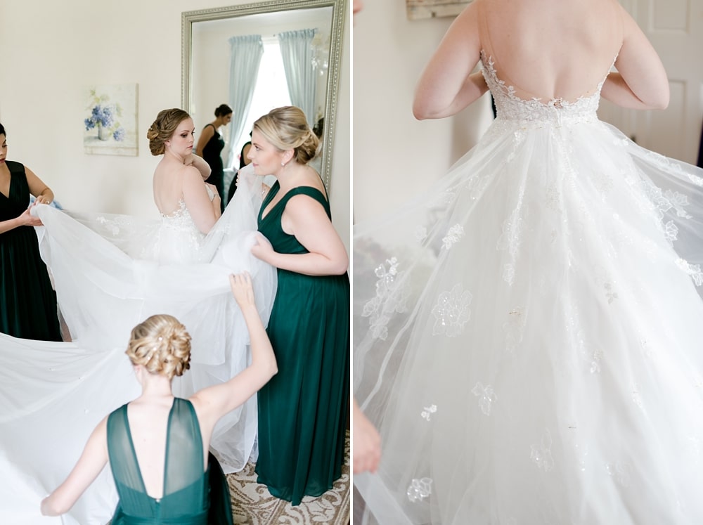 Bride getting into her gown in bridal suite at Rust Manor House wedding