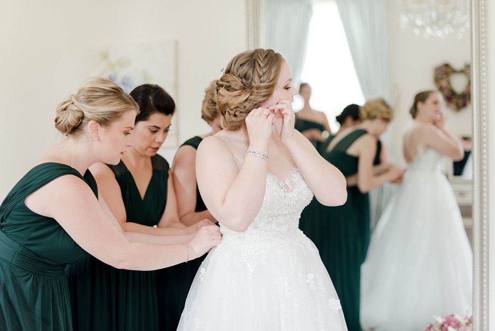 Bride and her bridesmaids getting ready at Rust Manor House wedding