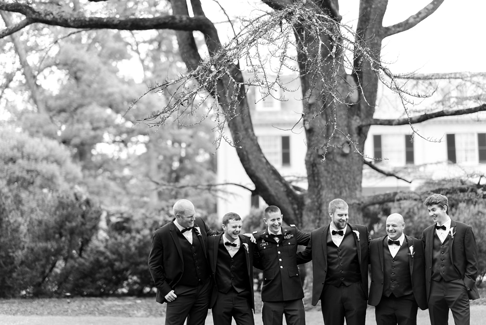 Groom and groomsmen on grounds of Rust Manor House in Leesburg VA