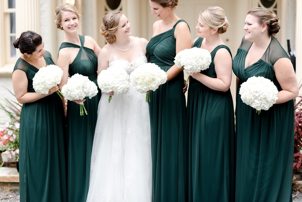 Bride and bridesmaids emerald green gowns at Rust Manor House wedding in Leesburg