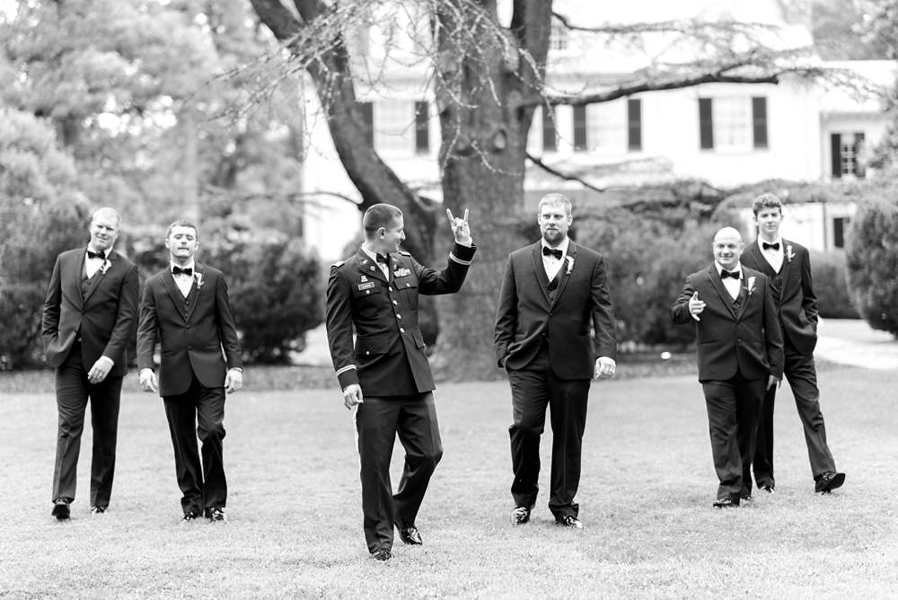 Groom and groomsmen walking at Rust Manor House wedding in Leesburg