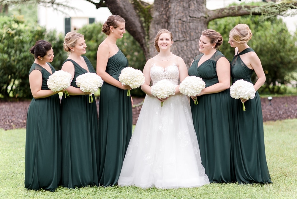 Bride and bridesmaids with Ricks Flowers bouquets at Rust Manor House wedding
