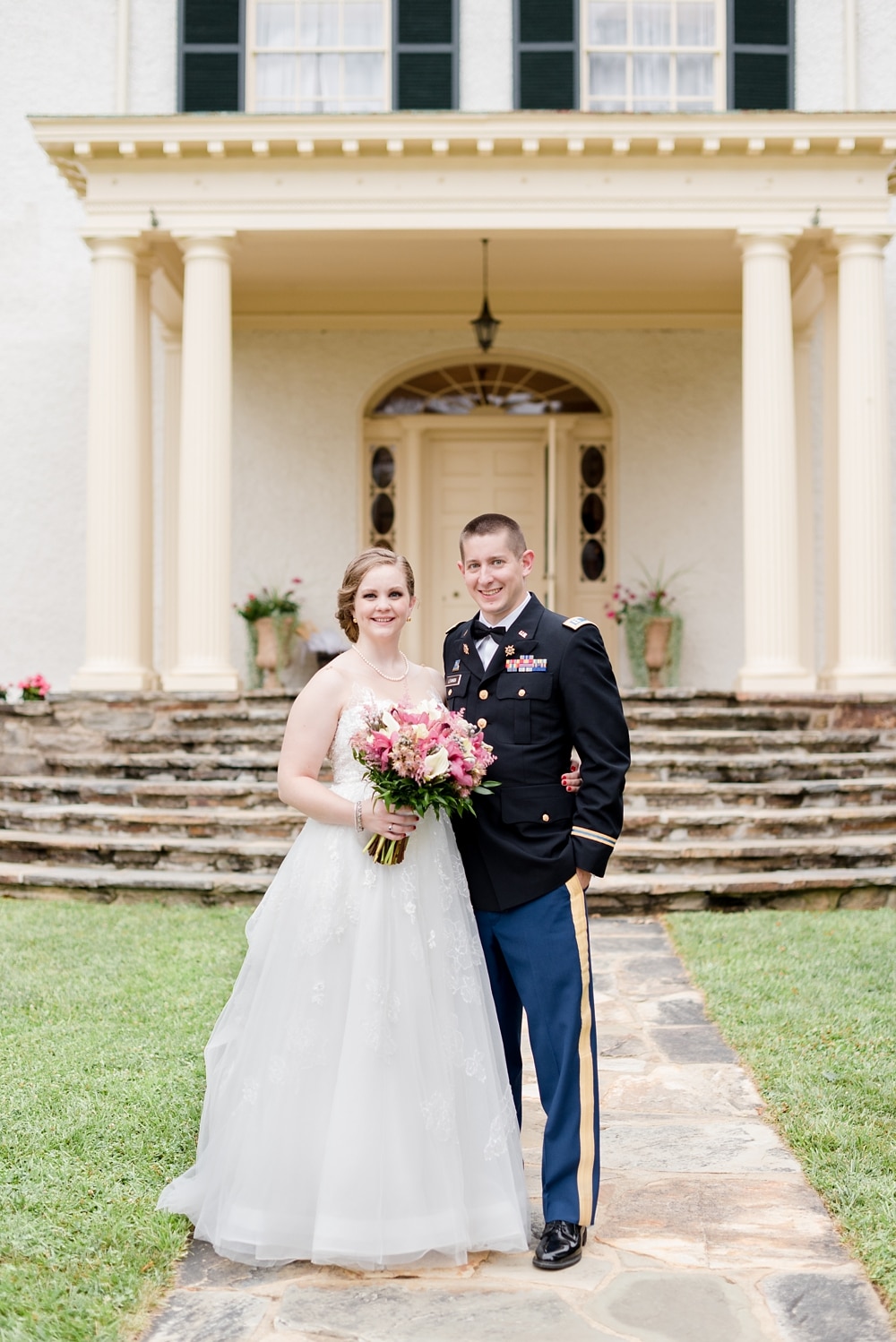 Bride and groom standing in front of steps at Rust Manor House in Loudoun County