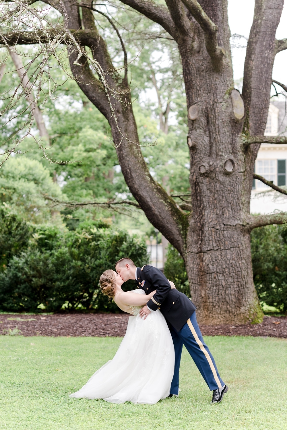 Bride and groom kissing at Rust Manor House wedding in Leesburg VA