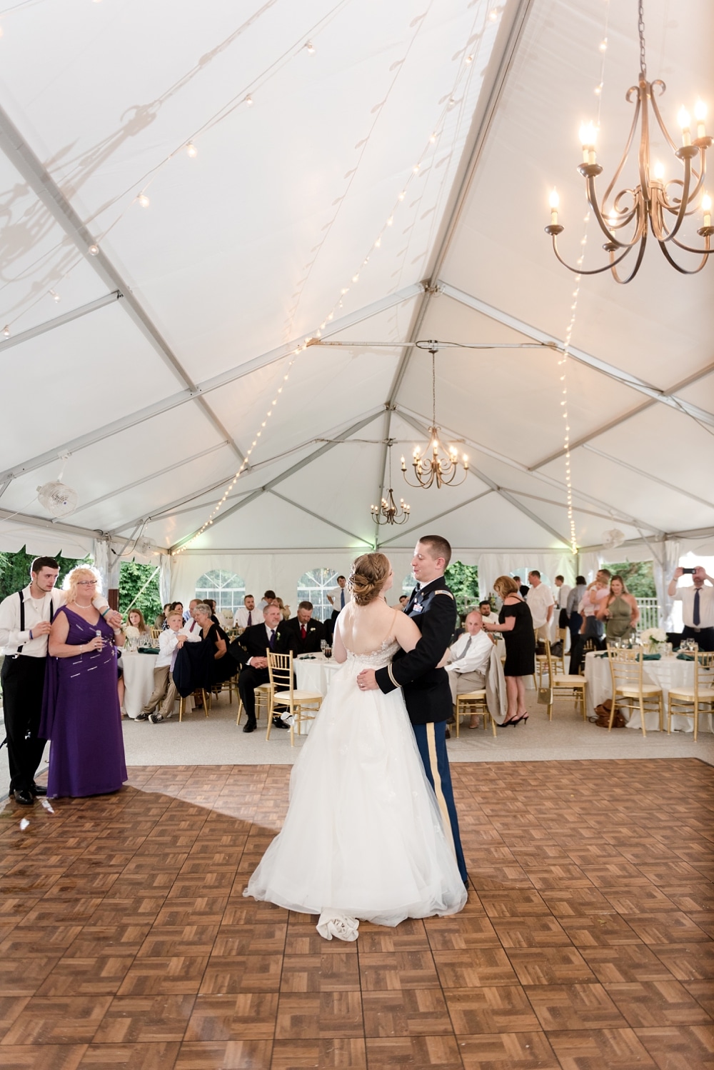 Bride and groom first dance under tent during reception at Rust Manor House