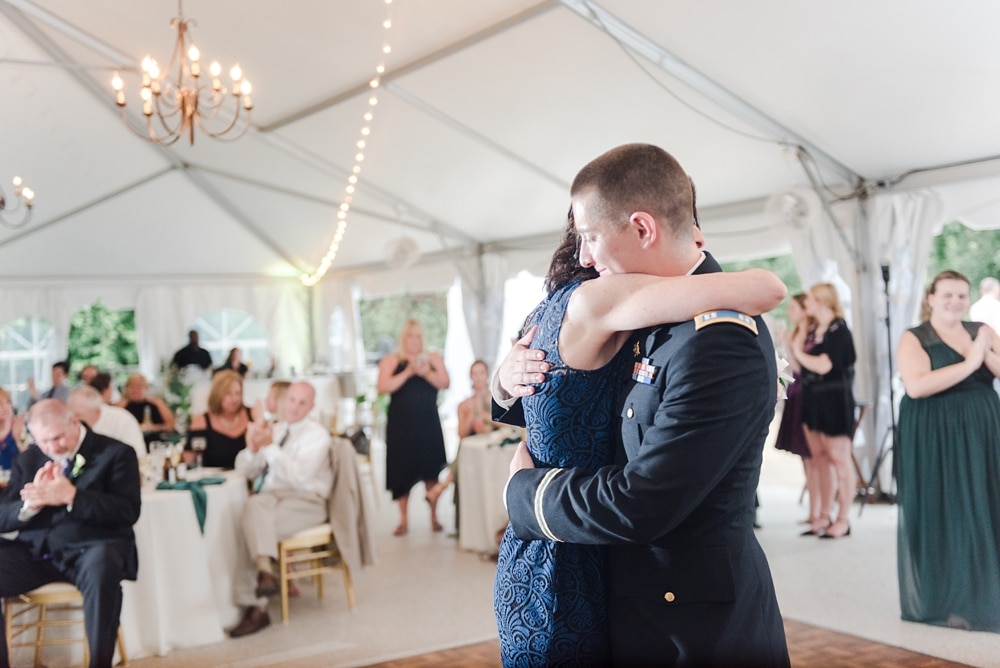 Groom mother son dance under tent during reception at Rust Manor House