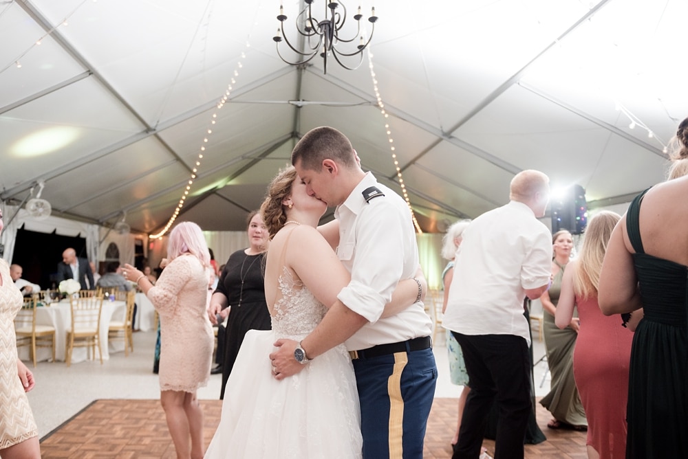 Bride and Groom kissing during wedding reception at Rust Manor House in Leesburg VA