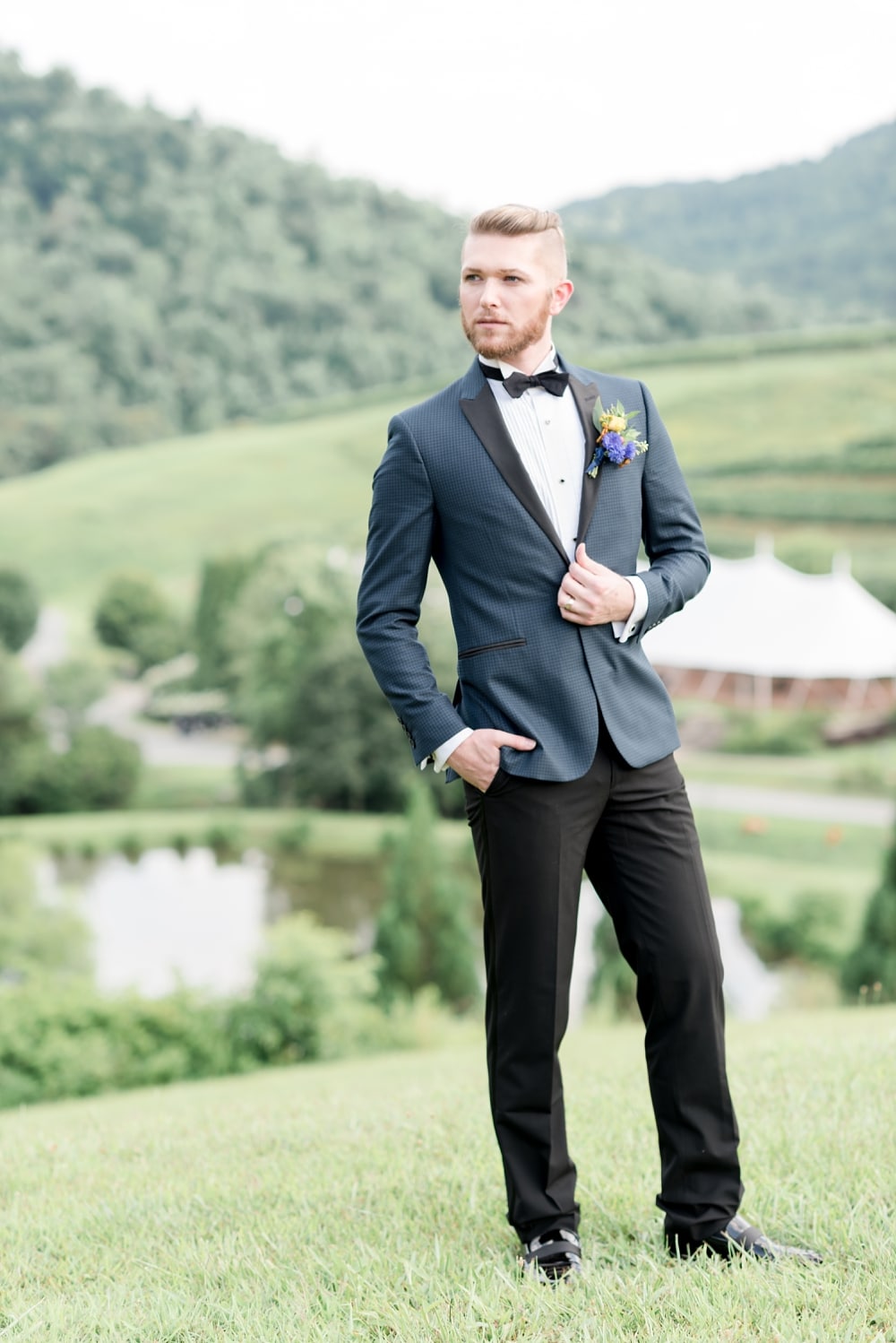 Groom standing for portrait at DelFosse Vineyards and Winery near Charlottesville VA