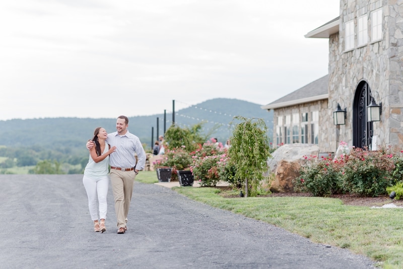 Engaged couple walking at Blue Valley Vineyard and Winery in Delaplane VA
