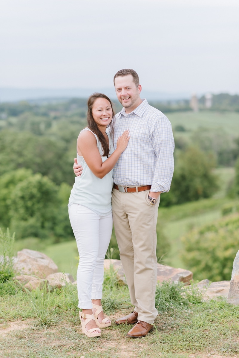 Couple smiling during their engagement session at Blue Valley Vineyard and Winery
