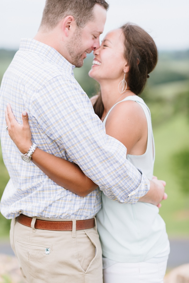 Engaged couple smiling at Blue Valley Vineyard and Winery in Delaplane VA