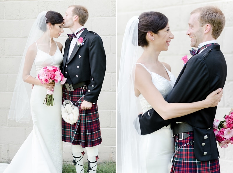 Groom kisses bride on forehead during their wedding portraits