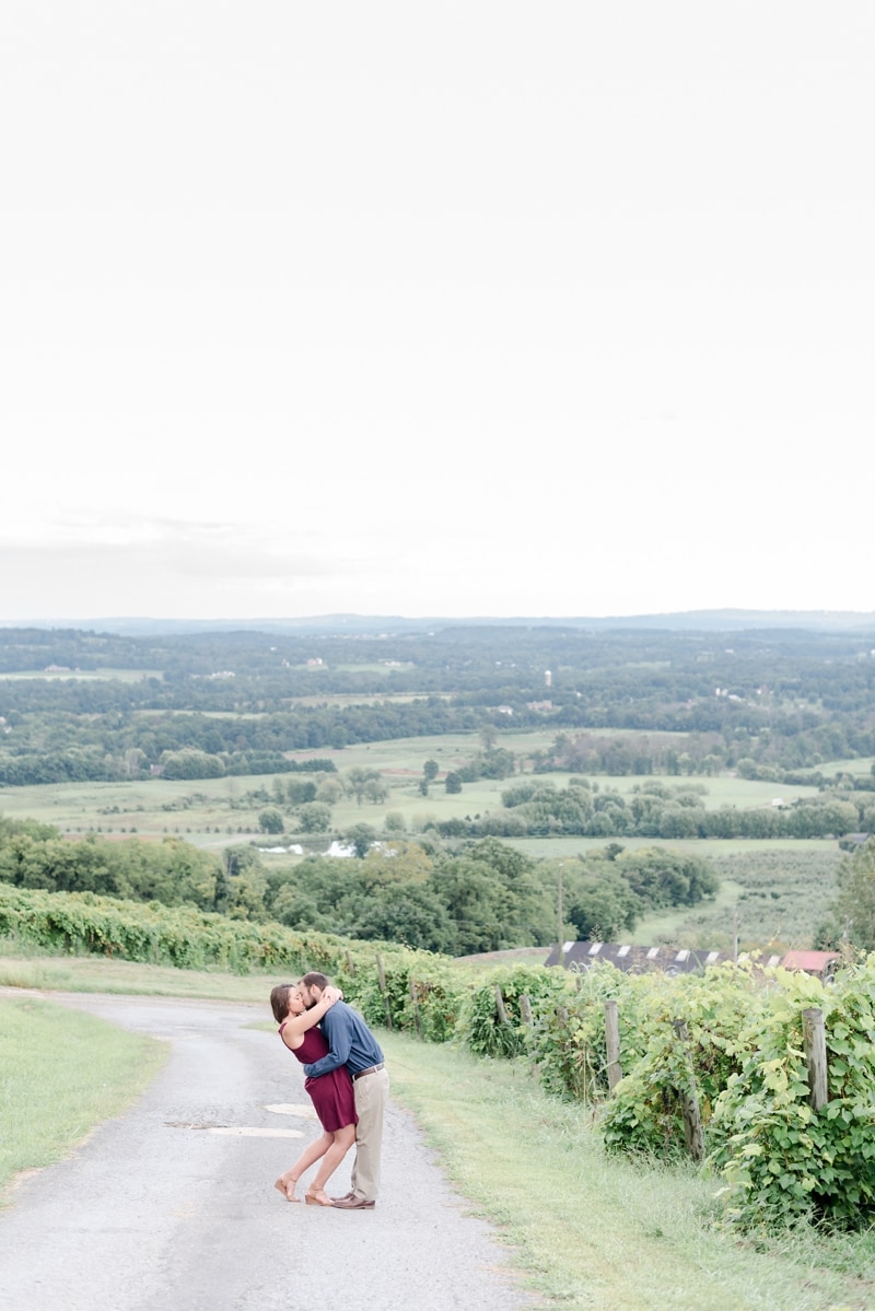 Couple kissing in front of scenic views in Bluemont VA