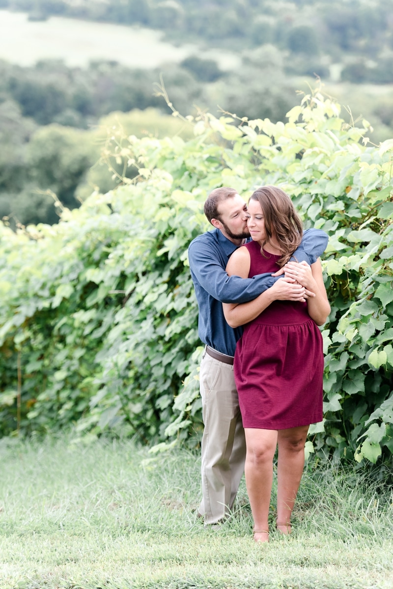 Couple in front of vines at views at Bluemont Vineyard