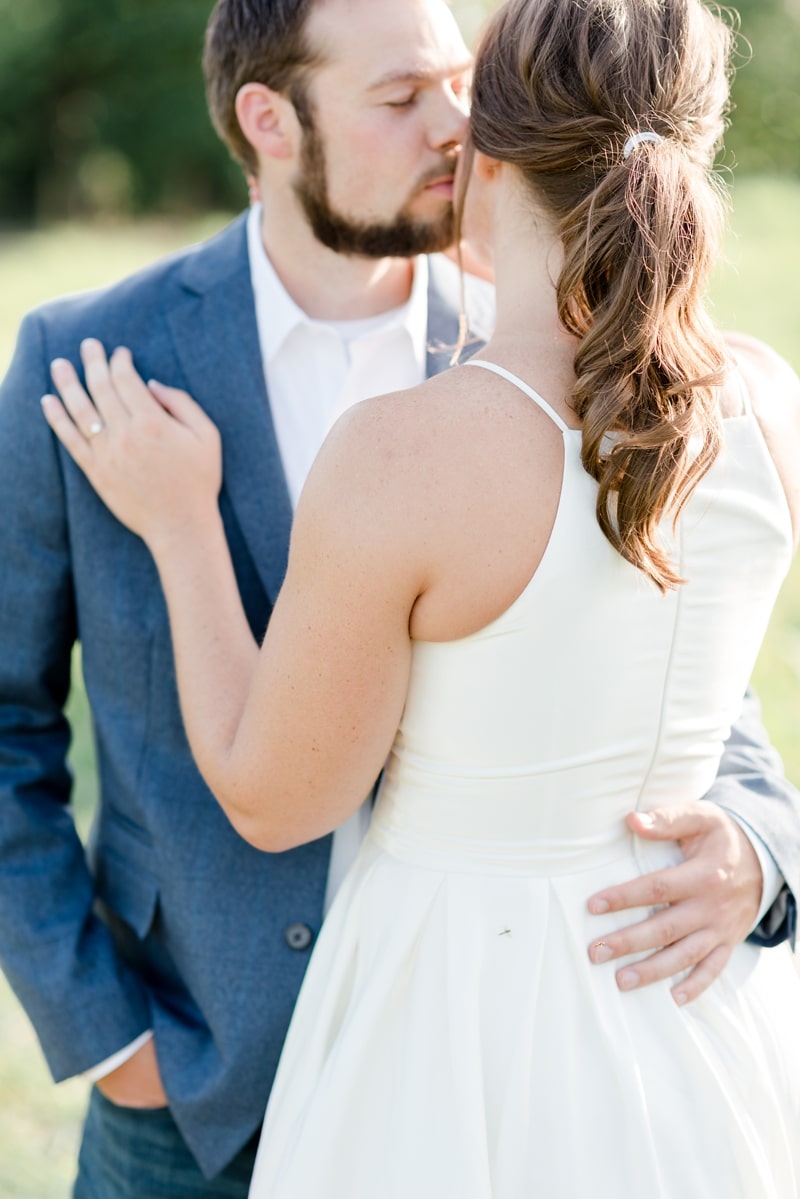 Future groom kisses his future wife on cheek during engagement session