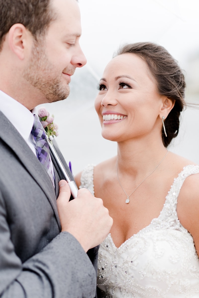 Bride smiling at groom during wedding day portraits