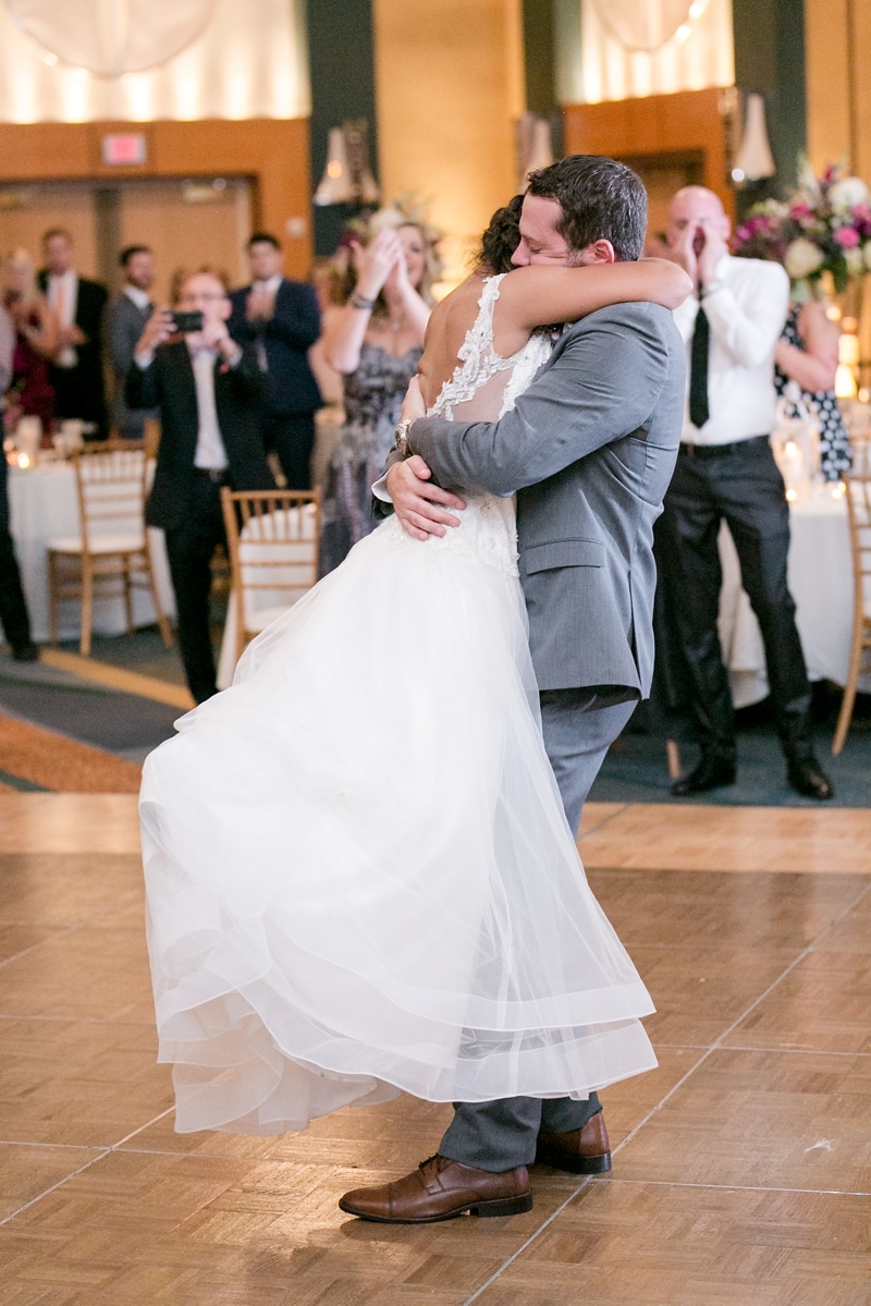 Husband and wife share a hug after their first dance together at their wedding