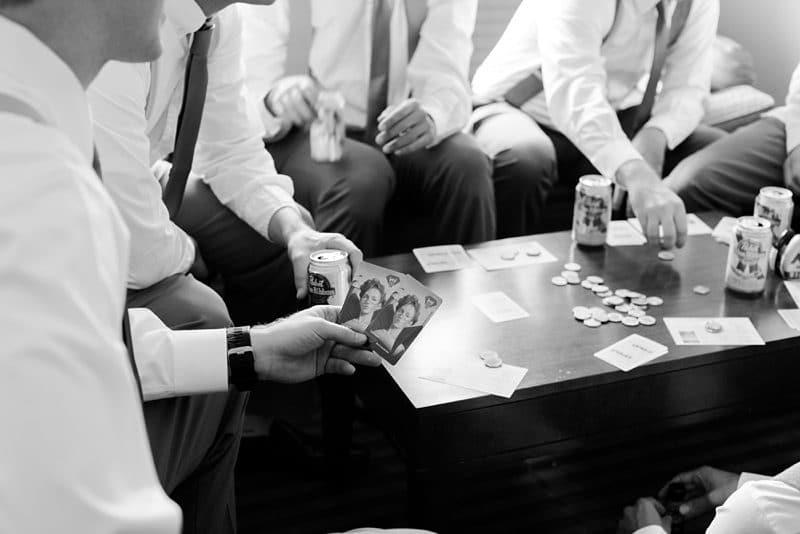 Guys playing card game before wedding