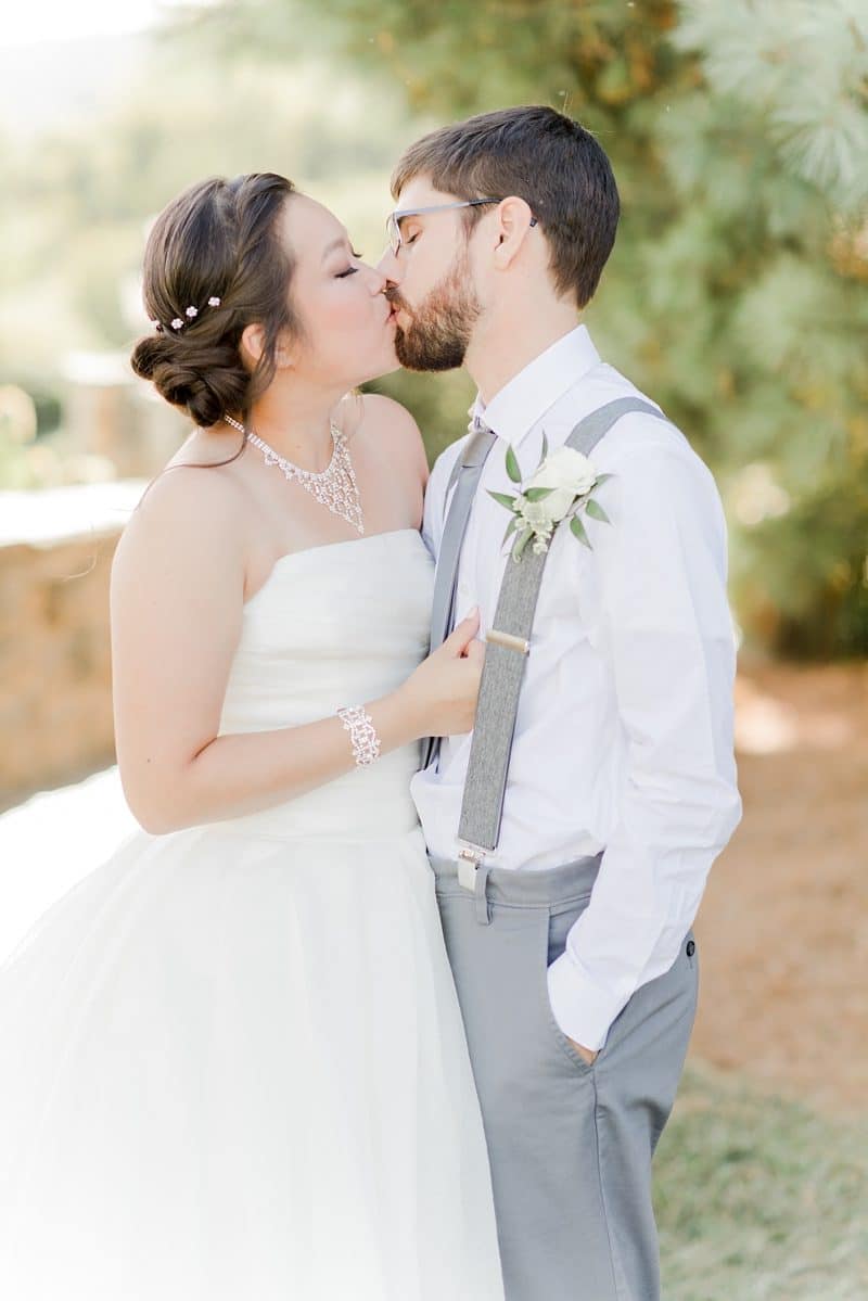 Bride and groom kissing each other at their Bluemont Vineyards wedding