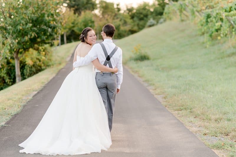 Mr and Mrs walking at Bluemont Vineyards