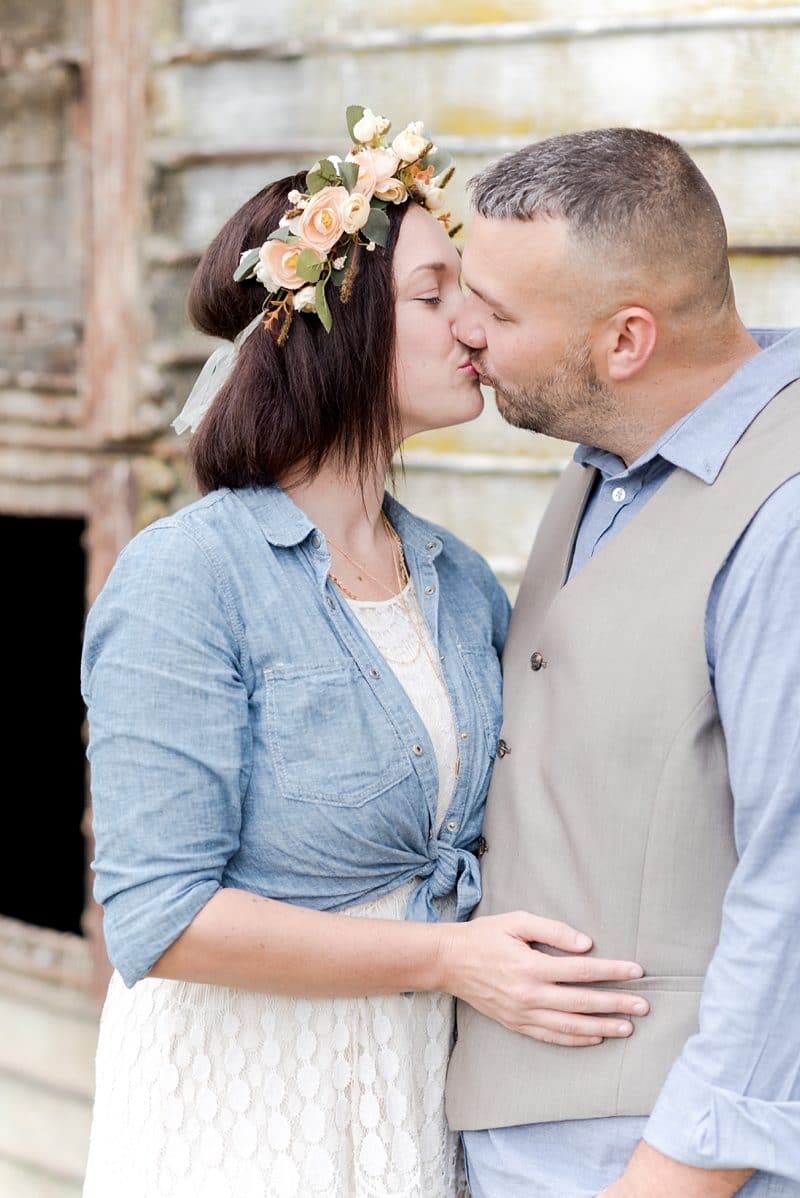 Parents kissing each other during photo session in Fredericksburg VA 