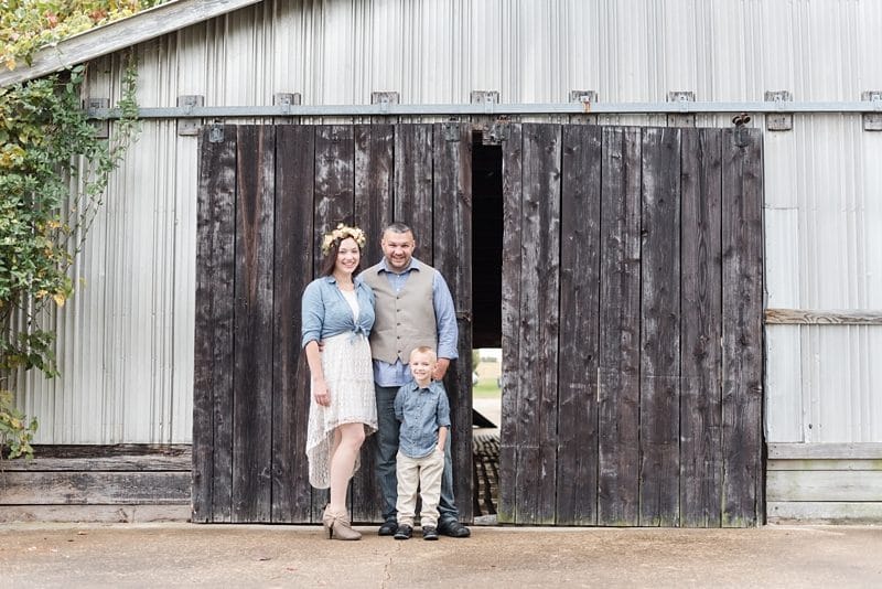 Family in front of barn door in Fredericksburg VA 