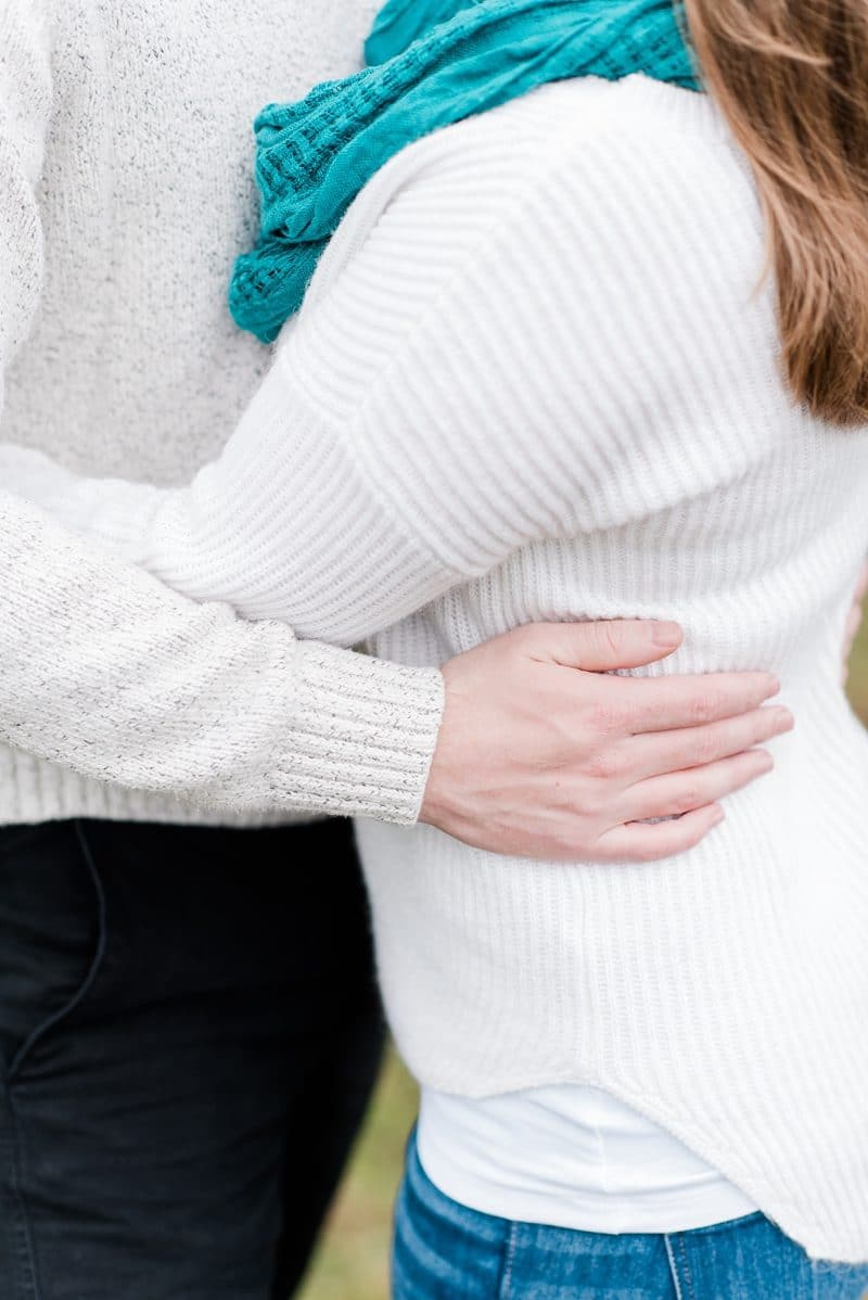 Couple holding each other during engagement session