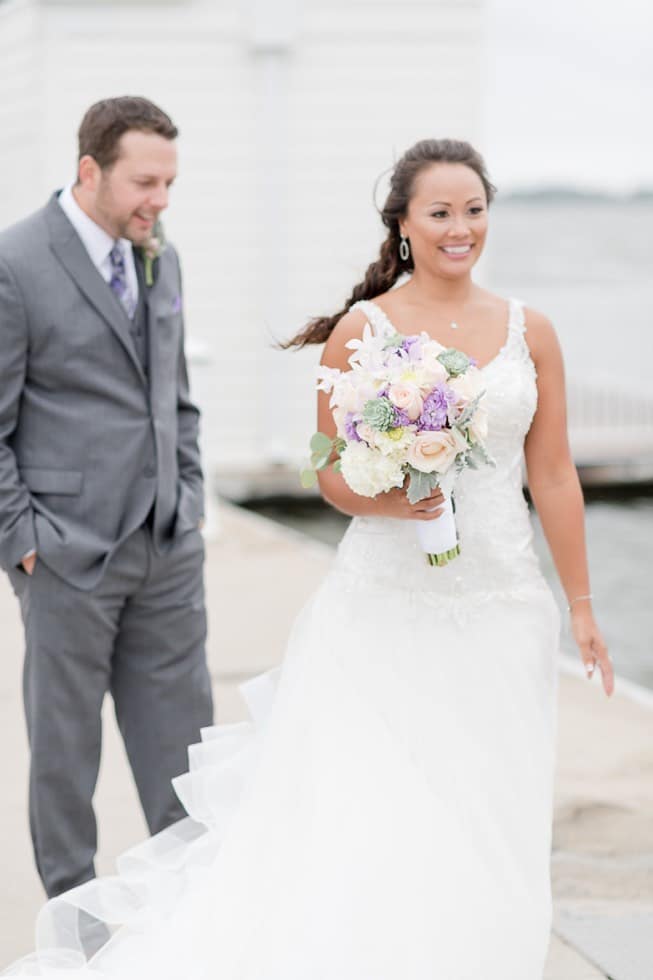 Groom admires his bride's dress during first look at Hyatt Regency Chesapeake Bay