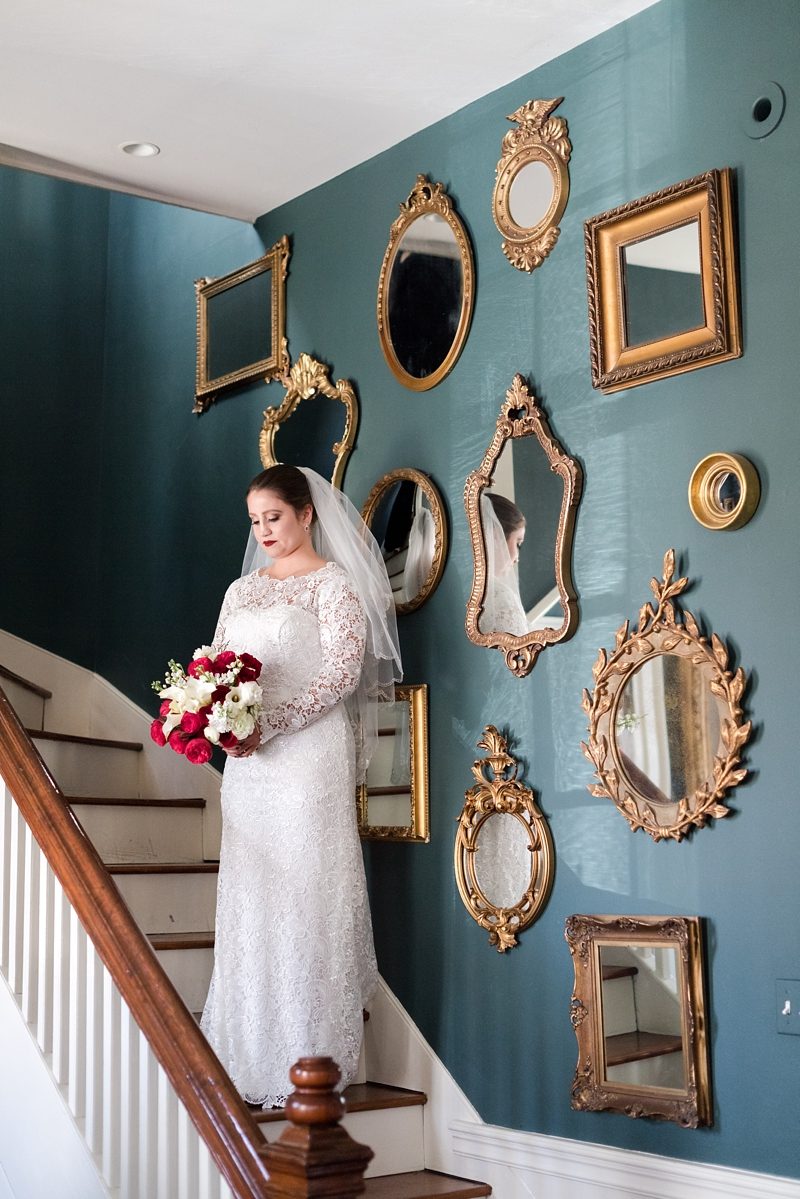 Bride on staircase with mirrors at Riddick House