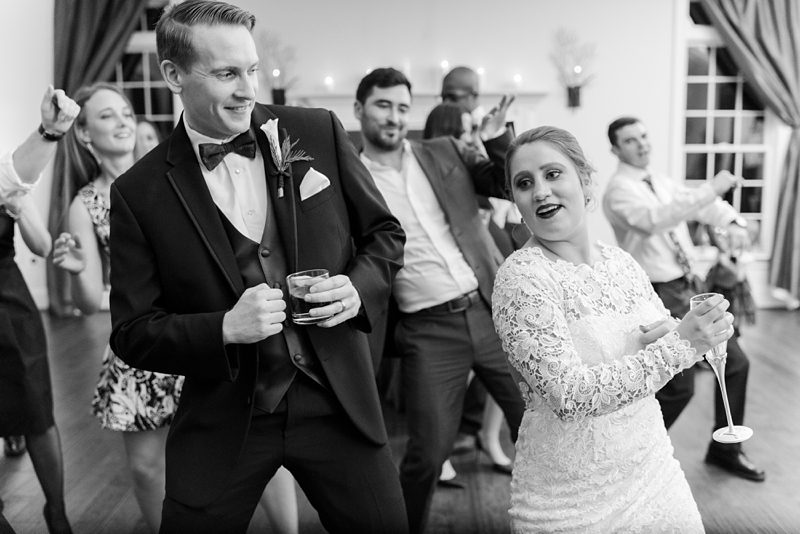 Bride and groom dancing the wobble during reception