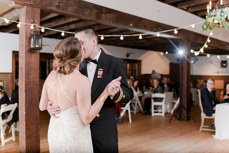 Kissing during first dance at Williamsburg Winery wedding