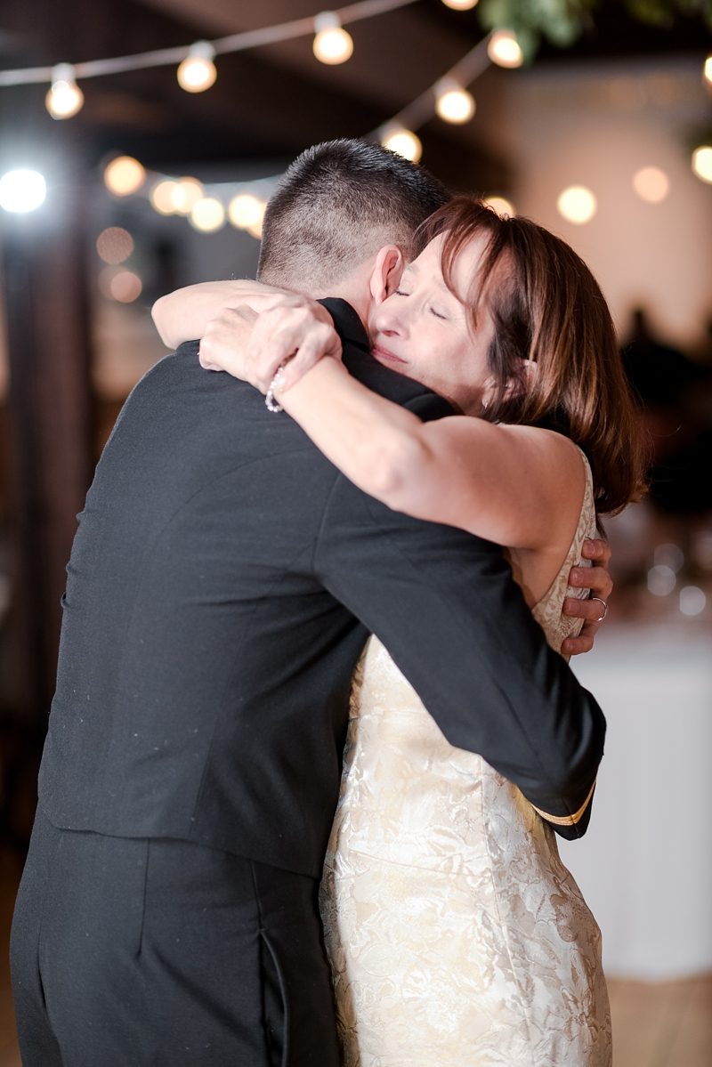 Mother and son hug each other after dancing together