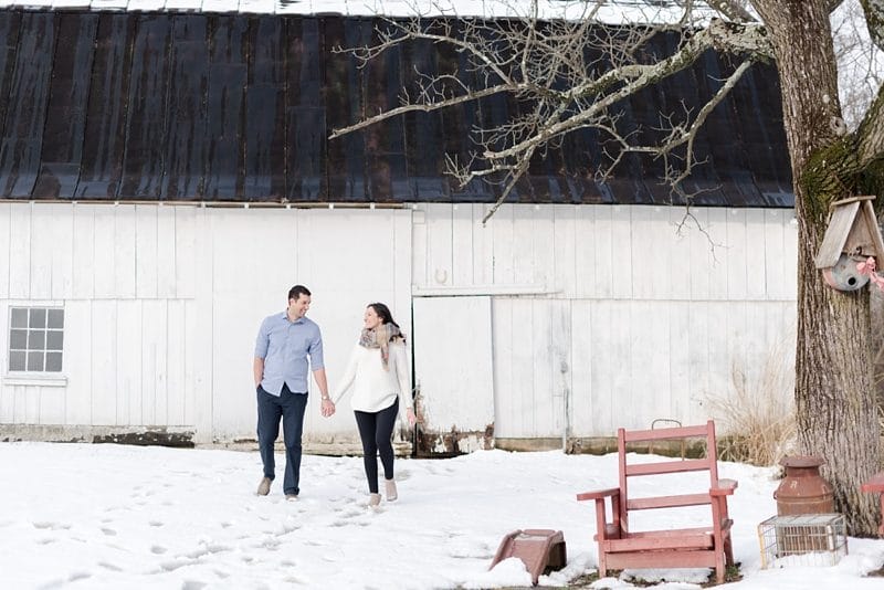 couple walking in snow at The Barns at Hamilton Station