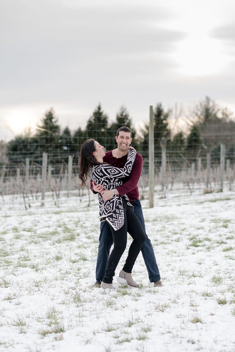 couple laughing during engagement session at The Barns at Hamilton Station