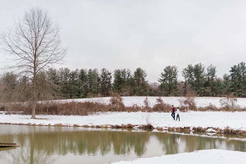 Couple walking by pond at The Barns at Hamilton Station in Leesburg